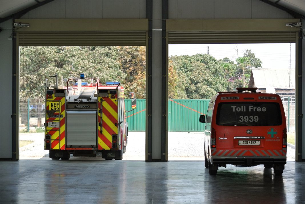 A fire engine and ambulance leaving their station