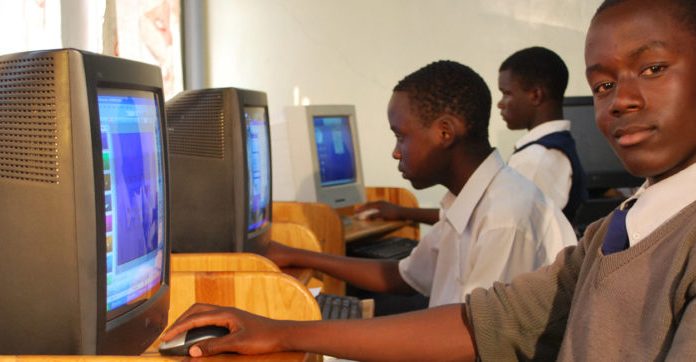 School kids receiving computer training